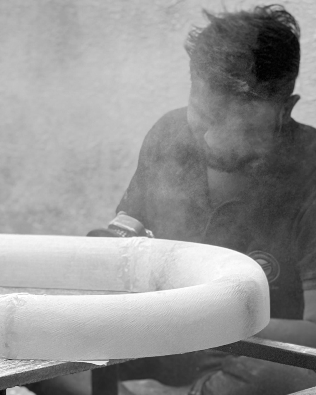 A craftsman shaping an alabaster form