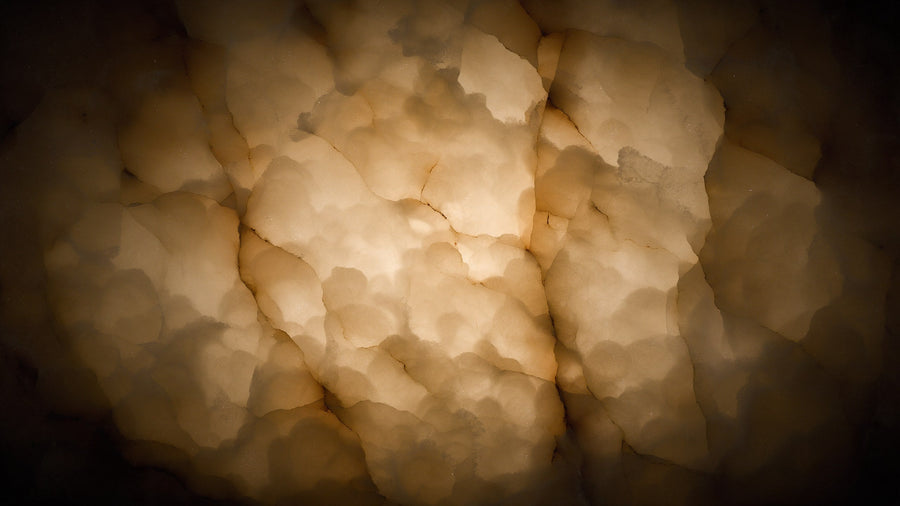 Close view of alabaster showing clouding and mineral veins under light