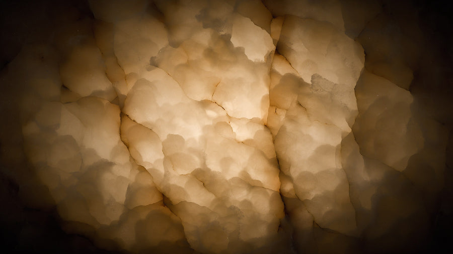 Spanish alabaster lit from within: honey clouds and fine amber veins